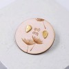 Stud earrings with gold-plating on wooden engraved card 
